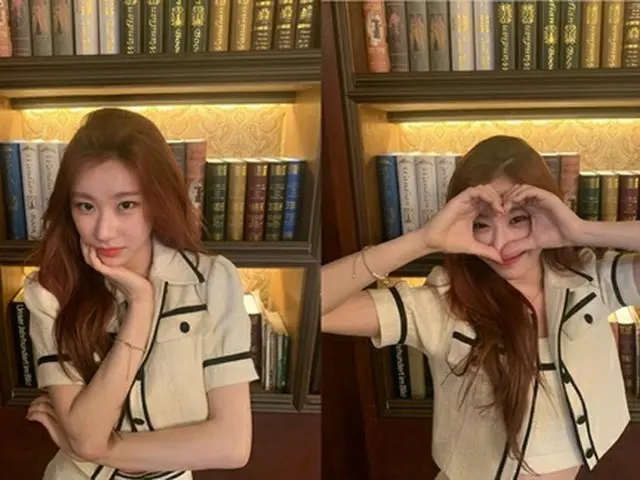 ITZY Chaeryeong, small face. Can't see her face with the heart of her hand.