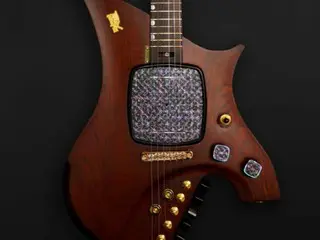 President Lee presents Singaporean Prime Minister Wong, a guitar enthusiast, with a Niraden lacquer-decorated guitar