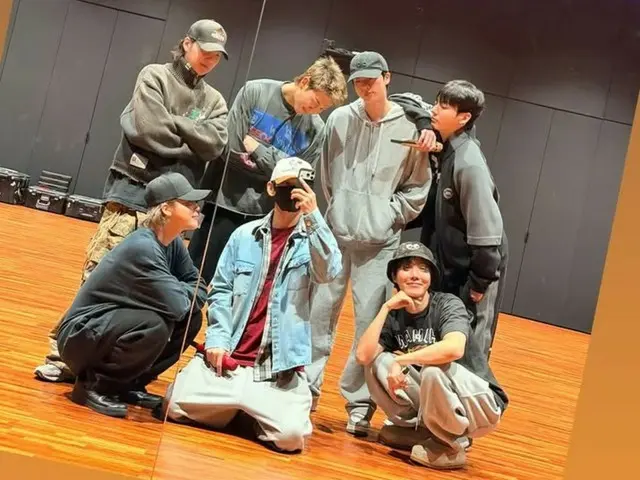 BTS' first photo showing them smiling together in the practice room after Discharge