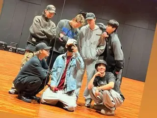 BTS' first photo showing them smiling together in the practice room after Discharge