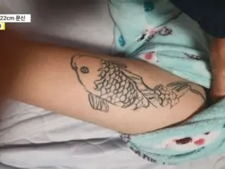 South Korea forcibly gives a junior high school student a 20cm carp tattoo, denying the charge and saying, ``I did it because I was asked.''