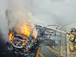 The car caught fire, but the driver ran away and the police are ``chasing'' him in South Korea.