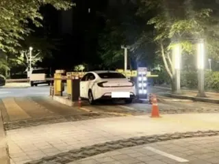 Unregistered car refused entry and closed apartment building entrance with vehicle in South Korea