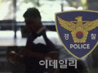 Police arrest Chinese man who filmed NIS with drone