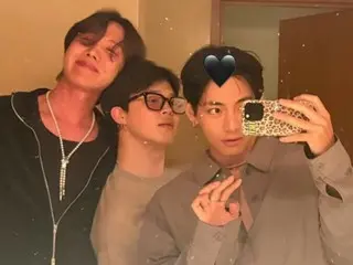 BTS' J-HOPE, JIMIN, and V create a romantic atmosphere with the sunset as the backdrop